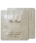 Two packets of 'The First Geniture' cream on a white background